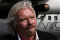 Virgin founder Richard Branson with one of Virgin Australia's regional aircraft.  