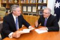 Treasurer Scott Morrison and Finance Minister Senator Mathias Cormann with copies of MYEFO at Parliament House in ...