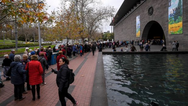 Crowds wait outside the NGV.