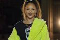 Rihanna acknowledges applause at the end of her ready-to-wear collection for Fenty as part of Paris Fashion Week.