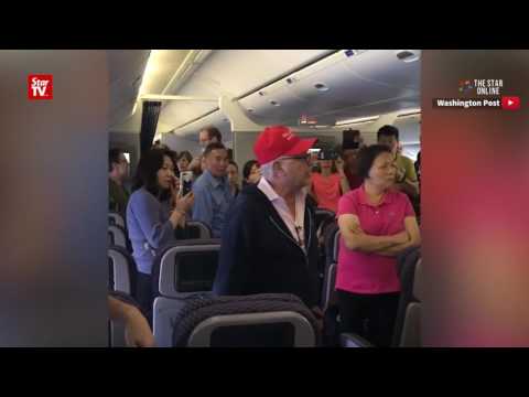 United Airlines flight removes man with Donald Trump cap