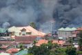 Smoke rises following airstrikes by Philippine Air Force to retake control of Marawi city, southern Philippines.