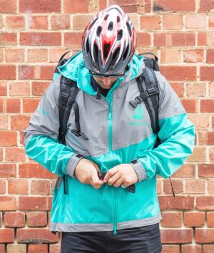 A Deliveroo driver in the current uniform, which is becoming a popular eBay item due to its highly reflective fabric. 