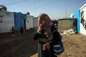 File - In this Monday, Dec. 7, 2015, photo, Ibtisam Ahmat weeps as she recounts her family's ordeal after fleeing the Islamic State invasion of Sinjar in 2014, and losing her home following the liberation of the city in November 2015. Islamic State militants who stormed into the Iraqi town of Sinjar in 2014, massacring members of the Yazidi minority and forcing women into sexual slavery.