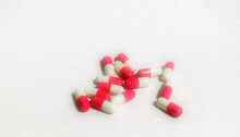 photo of red and white pill capsules