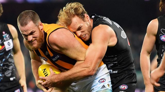 Port's Jack Hombsch stymies Hawks skipper Jarryd Roughead.