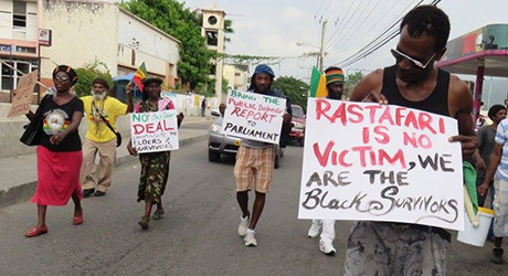  A group protests against government inaction on Rastafarian rights. Description of the photo for people with disabilities; © Credit courtesy of RCGBS