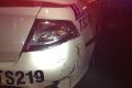 The damage sustained to the police car. 