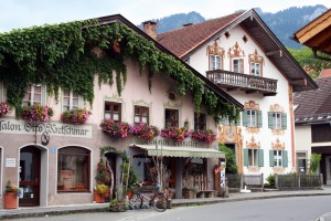 Traditional alpine buildings with frescoes.