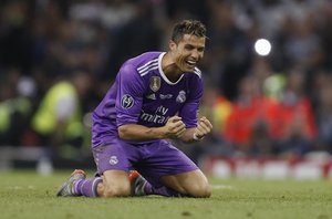 Real Madrid's Cristiano Ronaldo celebrates at the end of the Champions League final soccer match between Juventus and Real Madrid at the Millennium Stadium in Cardiff, Wales, Saturday June 3, 2017.