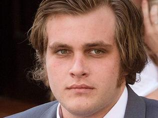 (FILES) This file photo taken on March 27, 2017 shows Henri van Breda (C) arriving with his lawyer Lorinda van Niekerk (L) at the Western Cape High Court for the start of his trial for allegedly killing his two parents, brother, and wounding his sister, with an axe, in their luxury home, in Cape Town. In a case that has gripped South Africa, the 22-year-old scion of a wealthy family goes on trial in Cape Town on April 24, 2017, accused of slaughtering his family in a frenzied axe attack. The case has also made headlines internationally, as police failed to arrest anyone for the grisly killings until Henri van Breda handed himself in. / AFP PHOTO / RODGER BOSCH