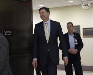 FBI Director James Comey walks on Capitol Hill in Washington, Thursday, May 4, 2017.