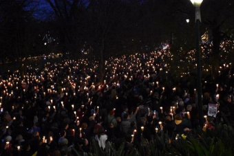 Wideshot of crowd in Treasury Gardens, Melbourne in refugee rally