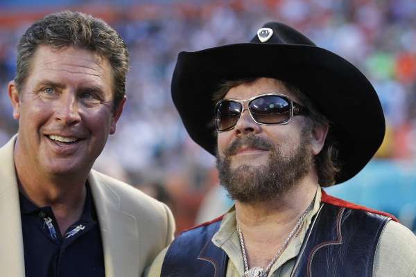 Former Miami Dolphins quarterback Dan Marino stands with Hank Williams Jr. before the start of a game between the Miami Dolphins and New England Patriots on Monday, Sept. 12, 2011, at Sun Life Stadium in Miami Gardens, Fla. (Charles Trainor Jr./Miami Herald/TNS)