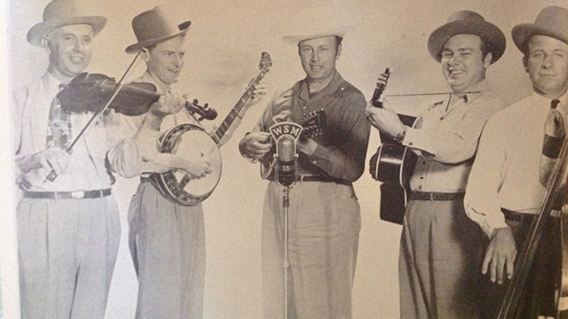 Bill Monroe and His Bluegrass Boys, c.1949. Mac Wiseman is 2nd from right, holding a guitar.