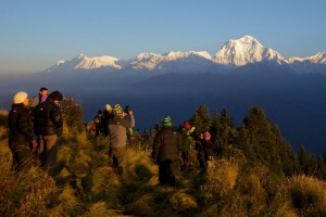 Tourists and trekkers enjoy view at dawn looking to Dhaulagiri from Poon Hill, Annapurna Region, Himalayas, Nepal, Asia.