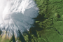 A satellite image of Mt Taranaki taken from 800,000 metres above - equivalent to nearly 318 Mt Taranaki's stacked on top ...