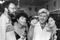 Club founder Ernie Melville (second from right) studying beer with members.