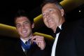 Father and son: Ben Cousins and his father Bryan after being awarded the Brownlow Medal in 2005.