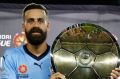 SYDNEY, AUSTRALIA - APRIL 15: Alex Brosque of Sydney FC is presented with the A - League Premier's Plate after the round ...