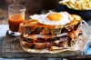 The Francesinha is Portugal's answer to the croque-madame. It's a meat-filled monster topped with egg and cheese and ...