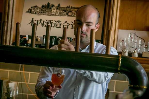 Bar manager Chase Branden Cottrell pours a beer at Hitachino in San Francisco, Calif., is seen on May 27th, 2017.