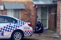 Police at the Northgate townhouse last month, where paramedics found Maddilyn-Rose Stokes unconscious and not breathing.