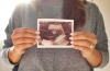 "Had our 20 week ultrasound yesterday. Karis decided to show us a little humor by tossing up a peace sign during the ...