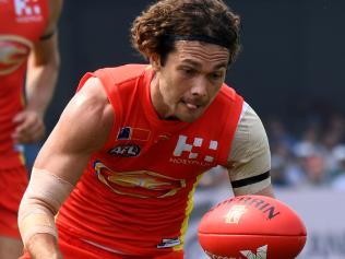 Jarrod Harbrow of the Gold Coast Suns passes during the round 8 match between the Gold Coast Suns and Port Adelaide Power at Jiangwan Stadium in Shanghai, China, Sunday, May 14, 2017. (AAP Image/Tracey Nearmy) NO ARCHIVING, EDITORIAL USE ONLY