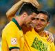 Tomi Juric and Tim Cahill enjoy an Asian Cup win over Oman in 2015.
