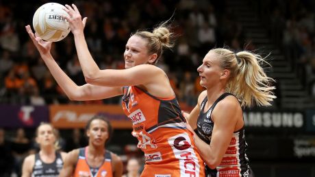 Collingwood's April Brandley puts pressure on the Giants' Jo Harten.