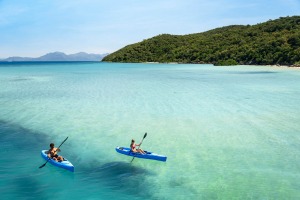 Kayaking over the azure waters of Hazard Bay, Orpheus Island. 110 km north of Townsville in the Coral Sea, this secluded ...