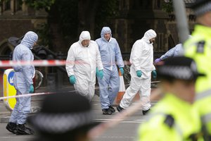 Forensic police investigate an area in the London Bridge area of London, Monday, June 5, 2017.