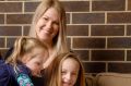 Erica Mitchell and her family are considering moving out of Canberra to a regional town as they struggle to cost with ...