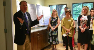 Senator Creigh Deeds celebrates a newly expanded space at The Women’s Initiative, which provides mental health services through a sliding scale walk-in clinic. Staff photo