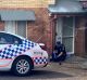 Police at the Northgate townhouse last month, where paramedics found Maddilyn-Rose Stokes unconscious and not breathing.