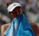 Spain's Garbine Muguruza wipes her face during her fourth round clash with France's Kristina Mladenovic.