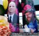 Candles with photos of Taliesin Namkai-Meche, right, and Ricky Best  sit at a memorial for the two men in Portland.