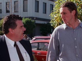 30Apr97: St Kilda footballer Peter Everitt - in Frankston court today after pleading guilty to one charge of "recklessly causing injury" - his victim was off-duty policeman Constable Stuart Buchanan. Solictor Robert Hession and client Peter Everitt outside Frankston magistrates court today. f/l /Football