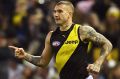 Dustin Martin of the Tigers celebrates kicking a goal against the Kangaroos.