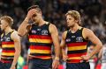 Taylor Walker (left) and Rory Sloane of the Crows look dejected after a loss during the 2017 AFL round 11 match between ...