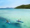 Kayaking over the azure waters of Hazard Bay, Orpheus Island. 110 km north of Townsville in the Coral Sea, this secluded ...