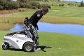 Founder of Empower Golf James Gribble demonstrates how the ParaGolfer works. 