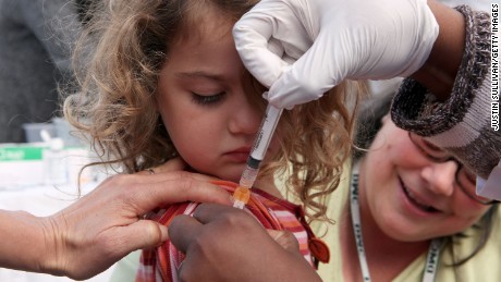 SAN PABLO, CA - NOVEMBER 05:  Three year-old Hannah Rood receives an H1N1 vaccination during a drive thru H1N1 vaccination clinic at Doctor&#39;s Medical Center November 5, 2009 in San Pablo, California. Hundreds of people lined up for hours to receive a free H1N1 vaccine as California public health officials say that shortages of the H1N1 vaccinations may make it imopssible to vaccinate all of the people at risk of contracting the H1N1 flu. County health agencies across California have received less than 45% of the vaccines ordered.  (Photo by Justin Sullivan/Getty Images)