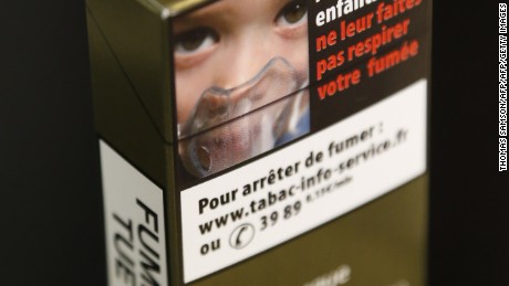 A picture taken on September 25, 2014 shows a sample of a &quot;plain cigarette packaging&quot; cigarette box proposed by the &quot;Alliance contre le tabac&quot; (alliance against tobacco) association. France on September 25 said it would introduce plain cigarette packaging and ban electronic cigarettes in certain public places, in a bid to reduce high smoking rates among the under-16s. Following a successful similar campaign in Australia, Health Minister Marisol Touraine said cigarette packets would be &quot;the same shape, same size, same colour, same typeset&quot; to make smoking less attractive to young smokers.    AFP PHOTO THOMAS SAMSON        (Photo credit should read THOMAS SAMSON/AFP/Getty Images)