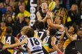 Riewoldt climbs over a big pack in a thriller against Geelong at the MCG last year.