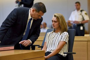 (Taunton, MA  050517)  Attorney Joseph Cataldo talks to his client Michelle Carter before meeting at a side bar at the beginning of the court session at Taunton Juvenile Court on Monday, June 5, 2017.  Staff Photo By Faith Ninivaggi