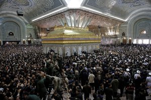 Mourners carry the coffin of former Iranian President Akbar Hashemi Rafsanjani during his burial at the shrine of the late revolutionary founder Ayatollah Khomeini just outside Tehran, Iran, Tuesday, Jan. 10, 2017.