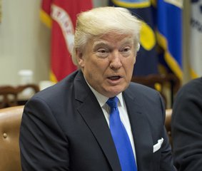 FILE - In this Tuesday, Jan. 24, 2017, file photo, President Donald Trump speaks during his meeting with automobile leaders in the Roosevelt Room of the White House in Washington.