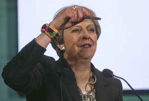 British Prime Minister Theresa May speaks during a news conference in the Sicilian town of Taormina, Italy, Friday May 26, 2017.